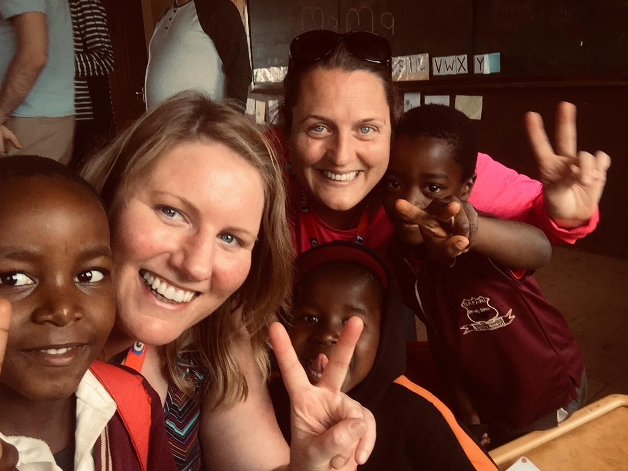 Children at local school in Hluhluwe area playing with tour group visitors