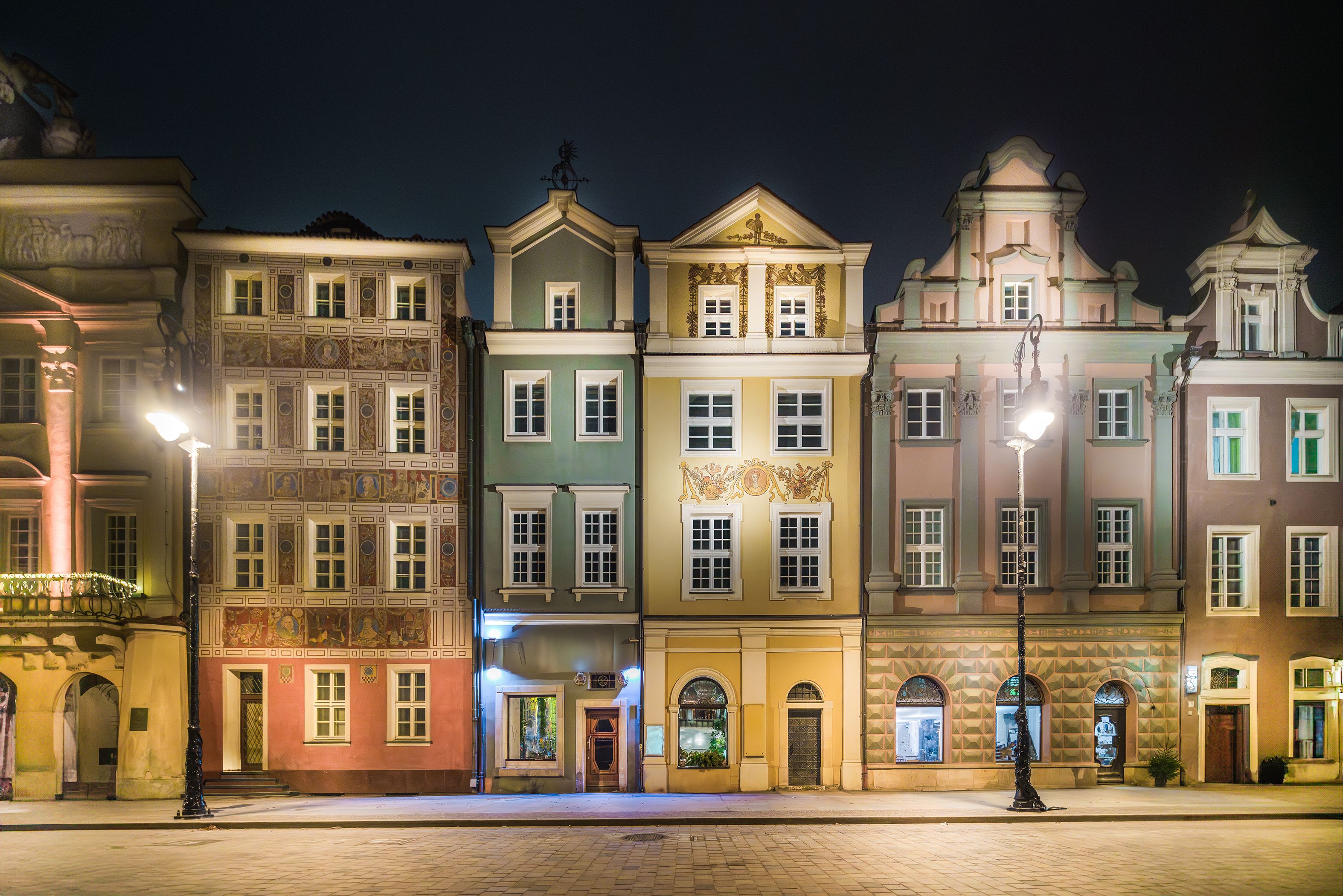 Colourful buildings in Kraków after dark
