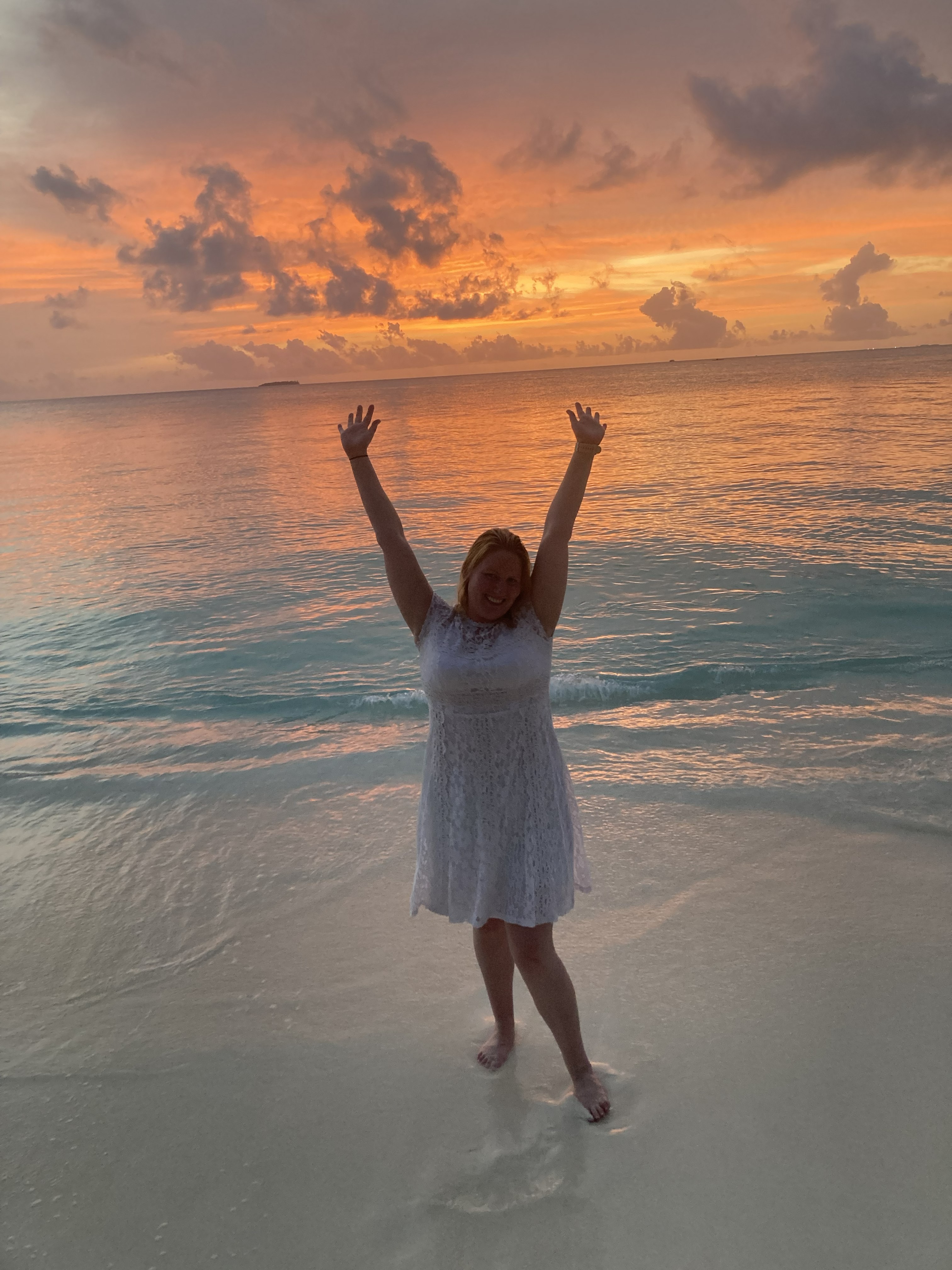 Person on swing in the sea Maldives — Two for the Row'd