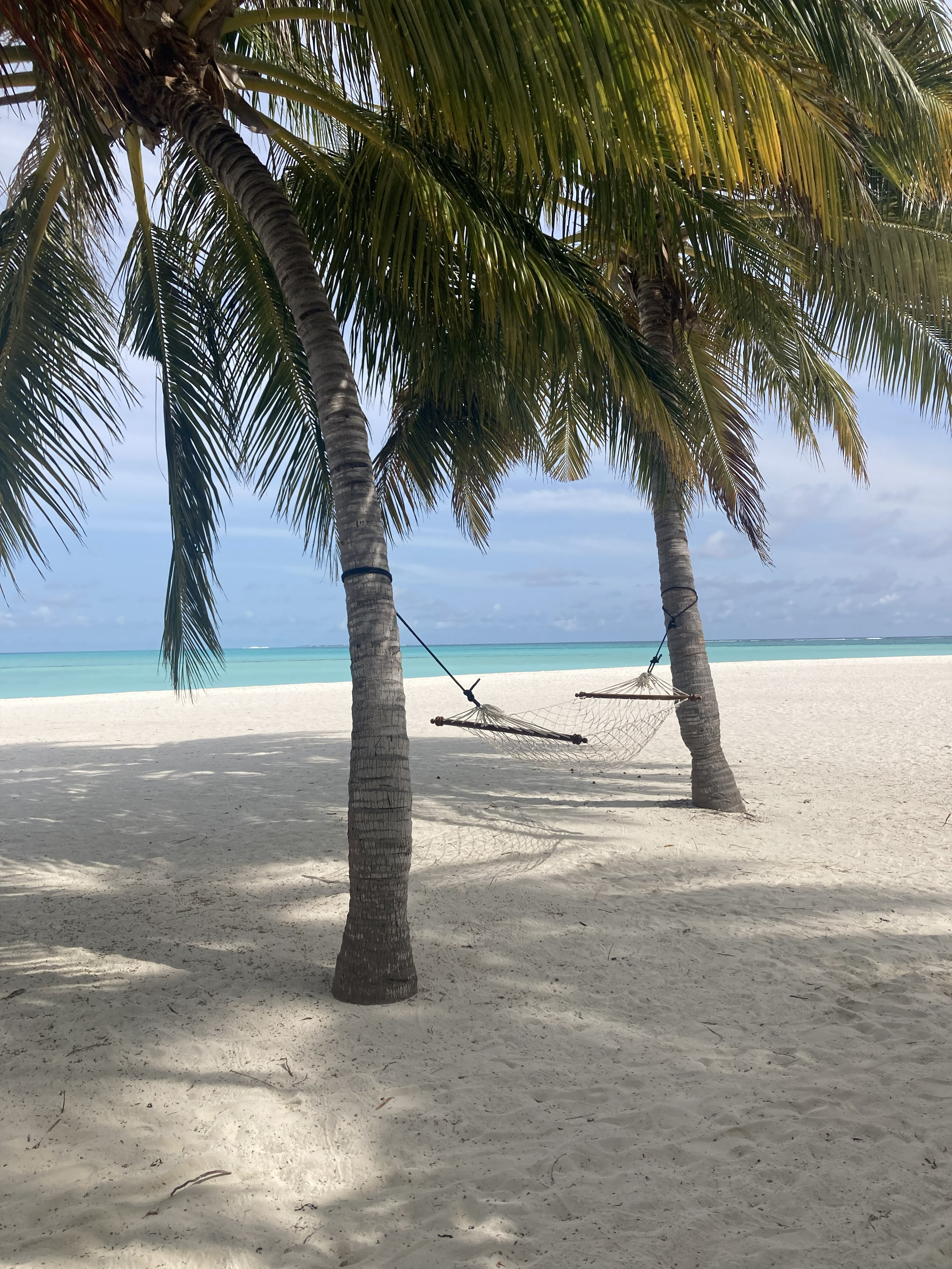 Couple on the beach Maldives — Two for the Row'd