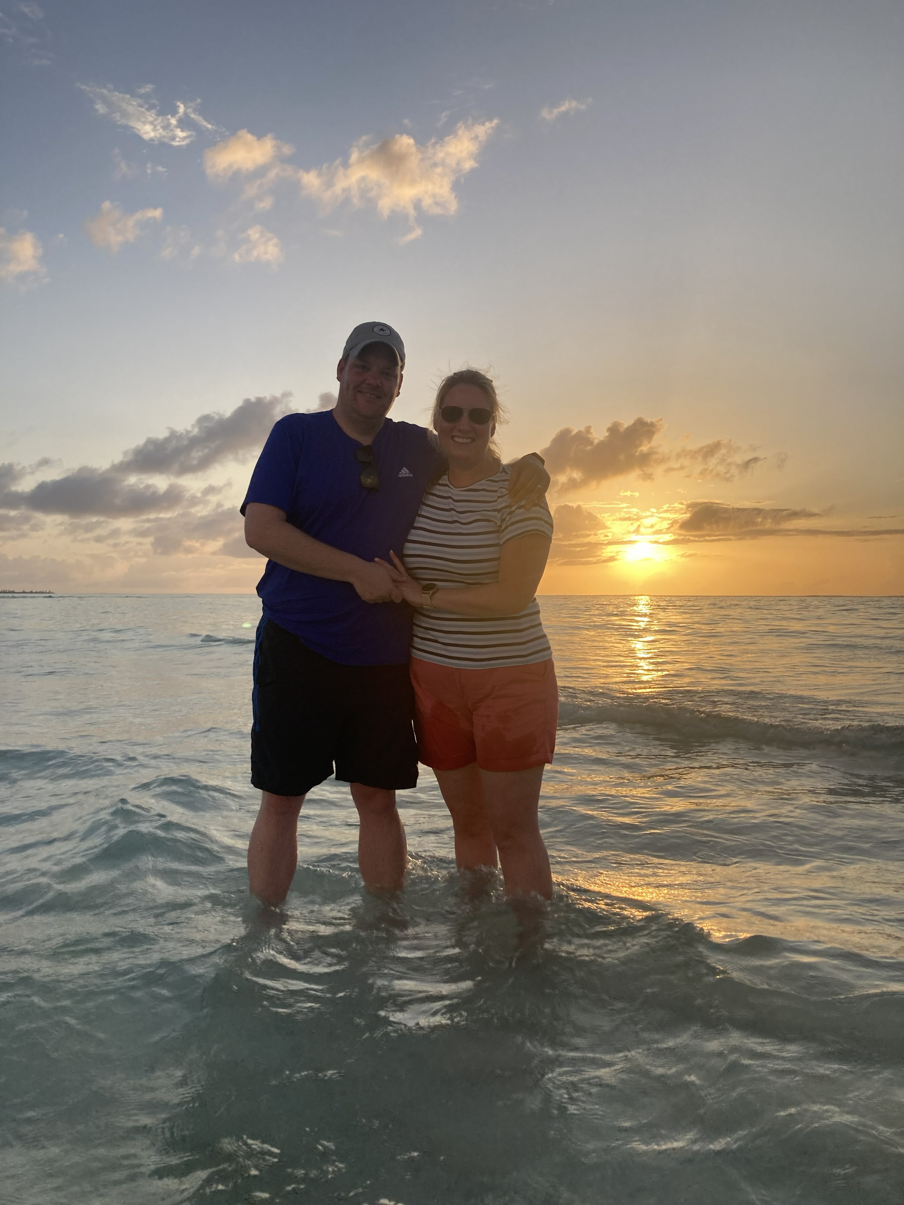 Couple in water at sunset Maldives — Two for the Row'd