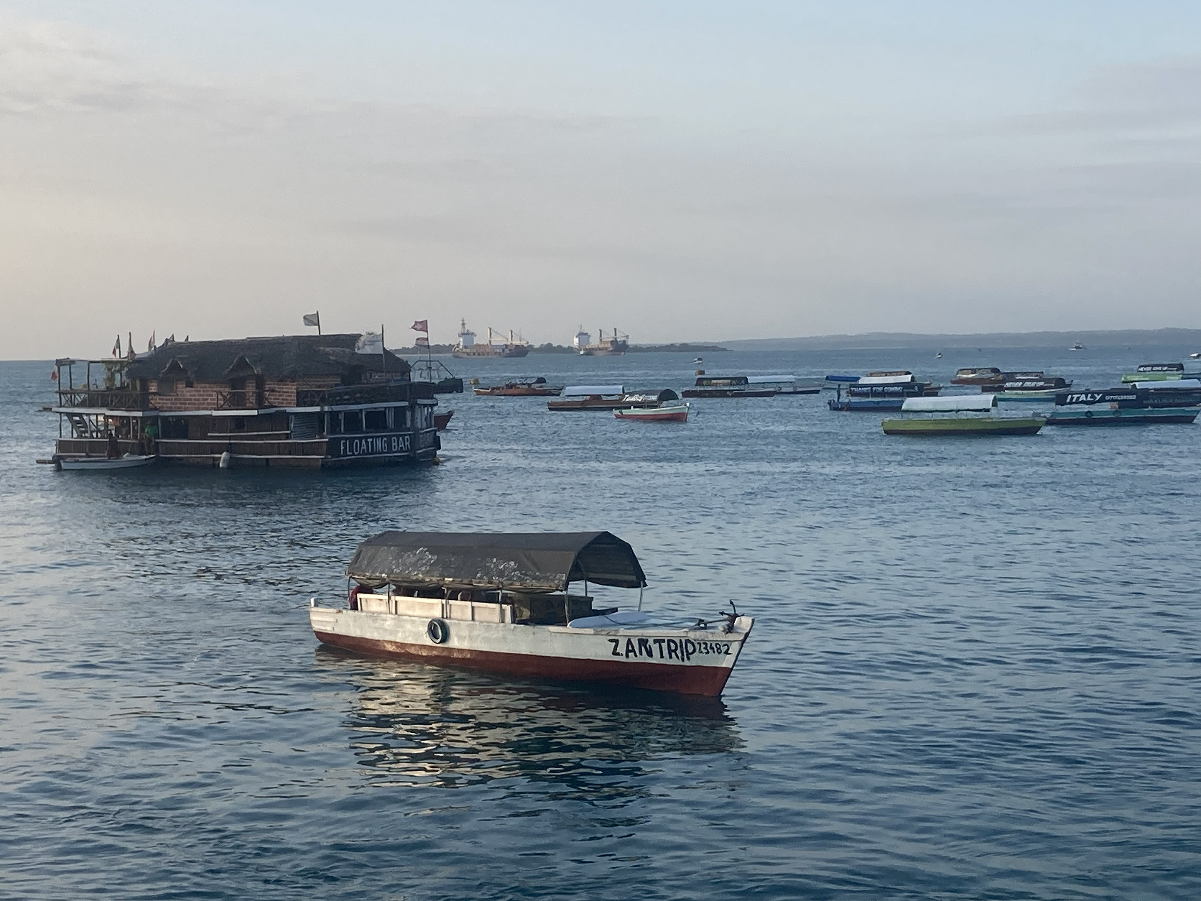 Boat on water at sunset Zanzibar — Two for the Row'd